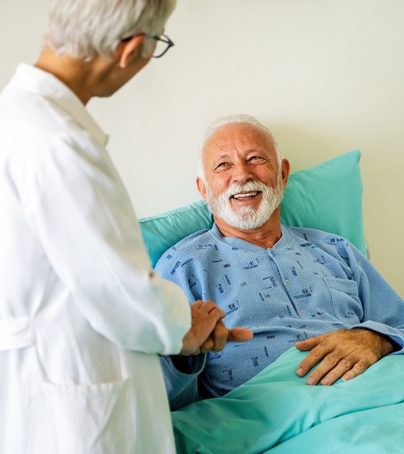 Nurse discussing home health referrals with an older patient